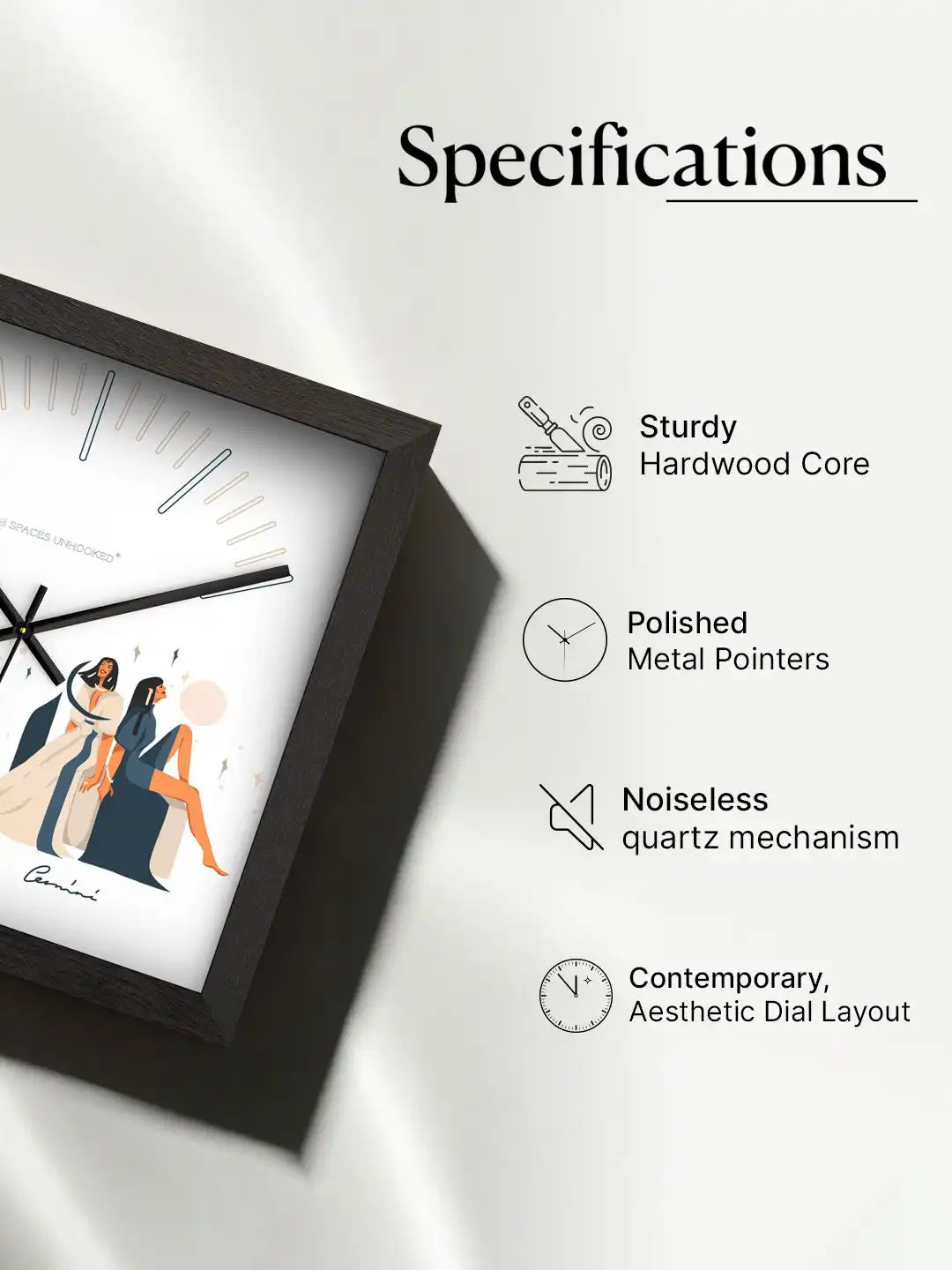 Three-dimensional angled view of the Gemini wall clock showcasing its deep black frame, clean white dial, and artistic zodiac illustration.