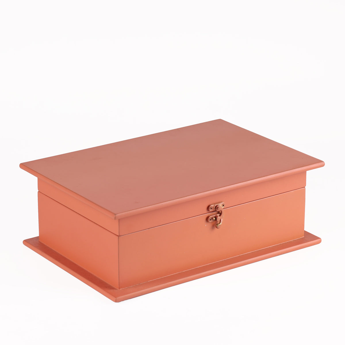 Coral-colored jewelry box with a gold clasp 