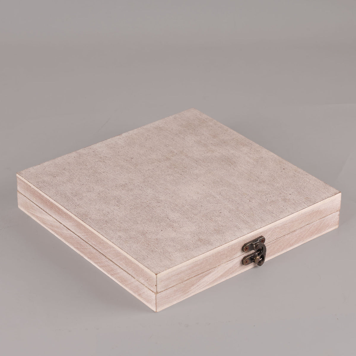 Beige jewelry box with a metallic clasp 