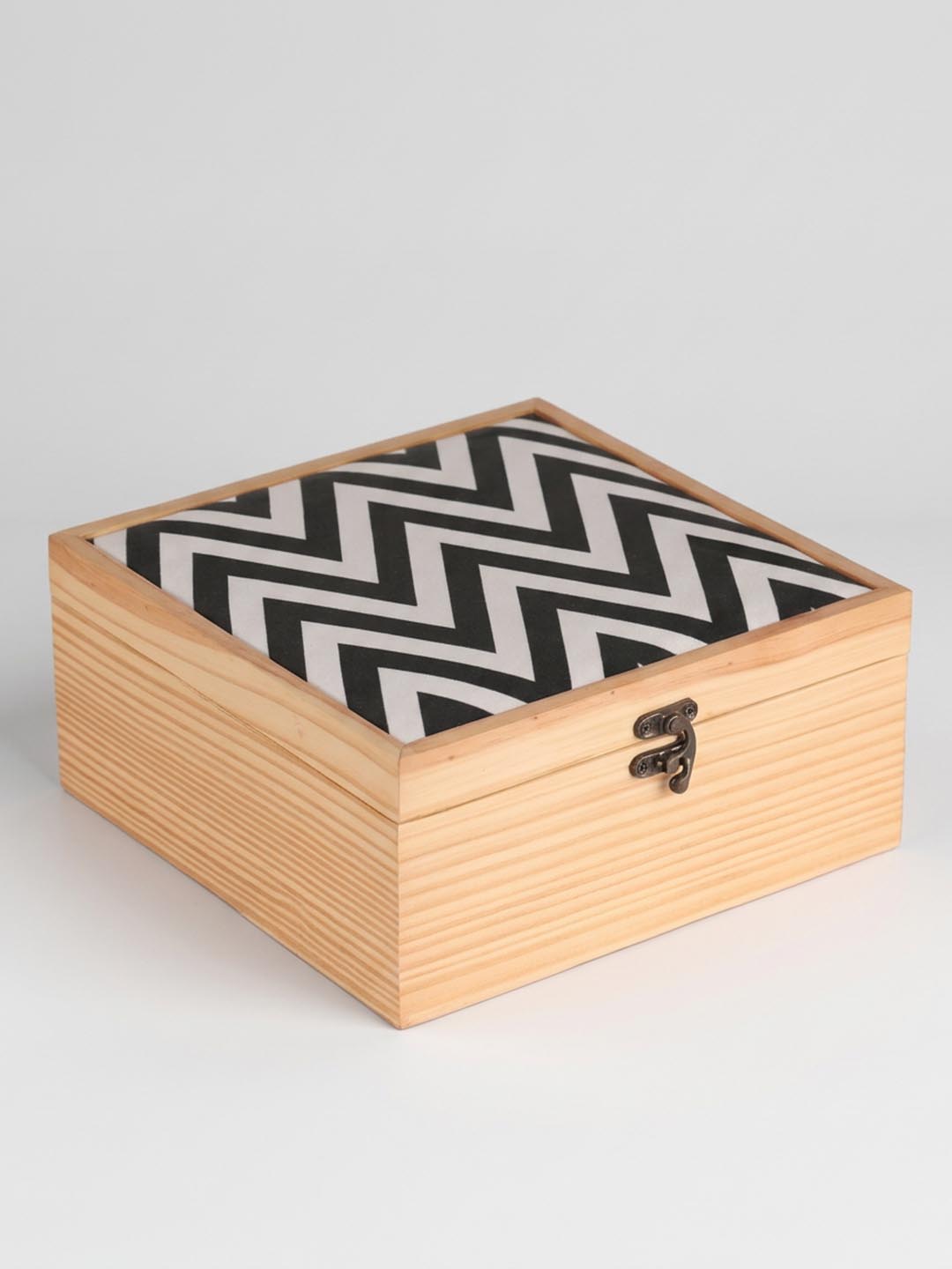 Wooden box with a black and white zigzag pattern 