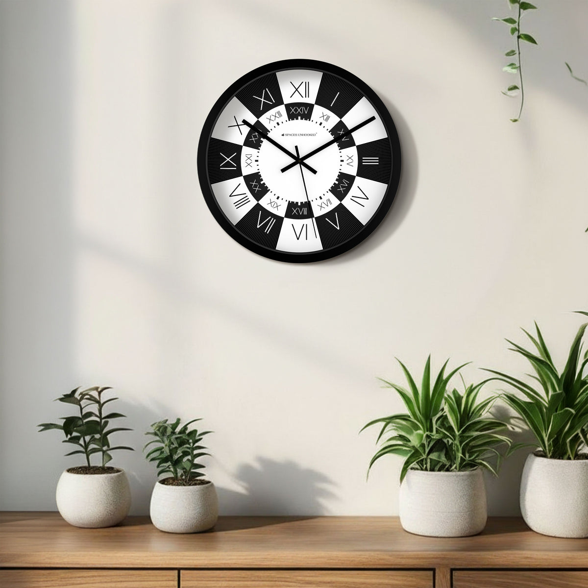 Spaces Unhooked bold black white wall clock 3/4 view dual Roman numeral dial – premium statement wall clock India