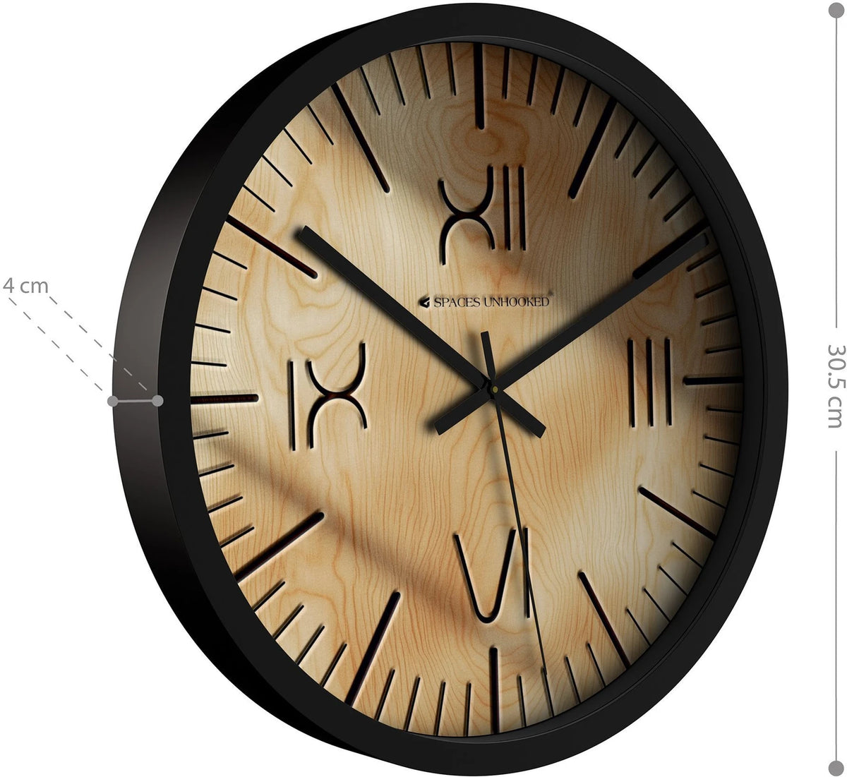 Wooden wall clock with black frame placed on a modern table with plant decor