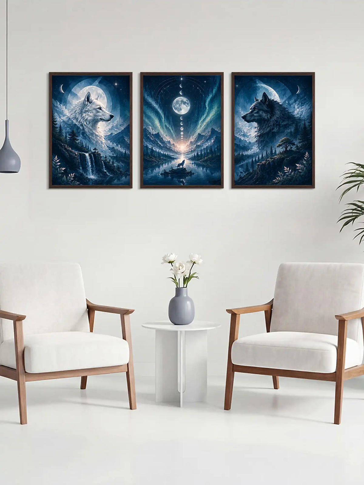 Three wolf paintings on a wall above a small table with a vase and flowers, in a room with two chairs.